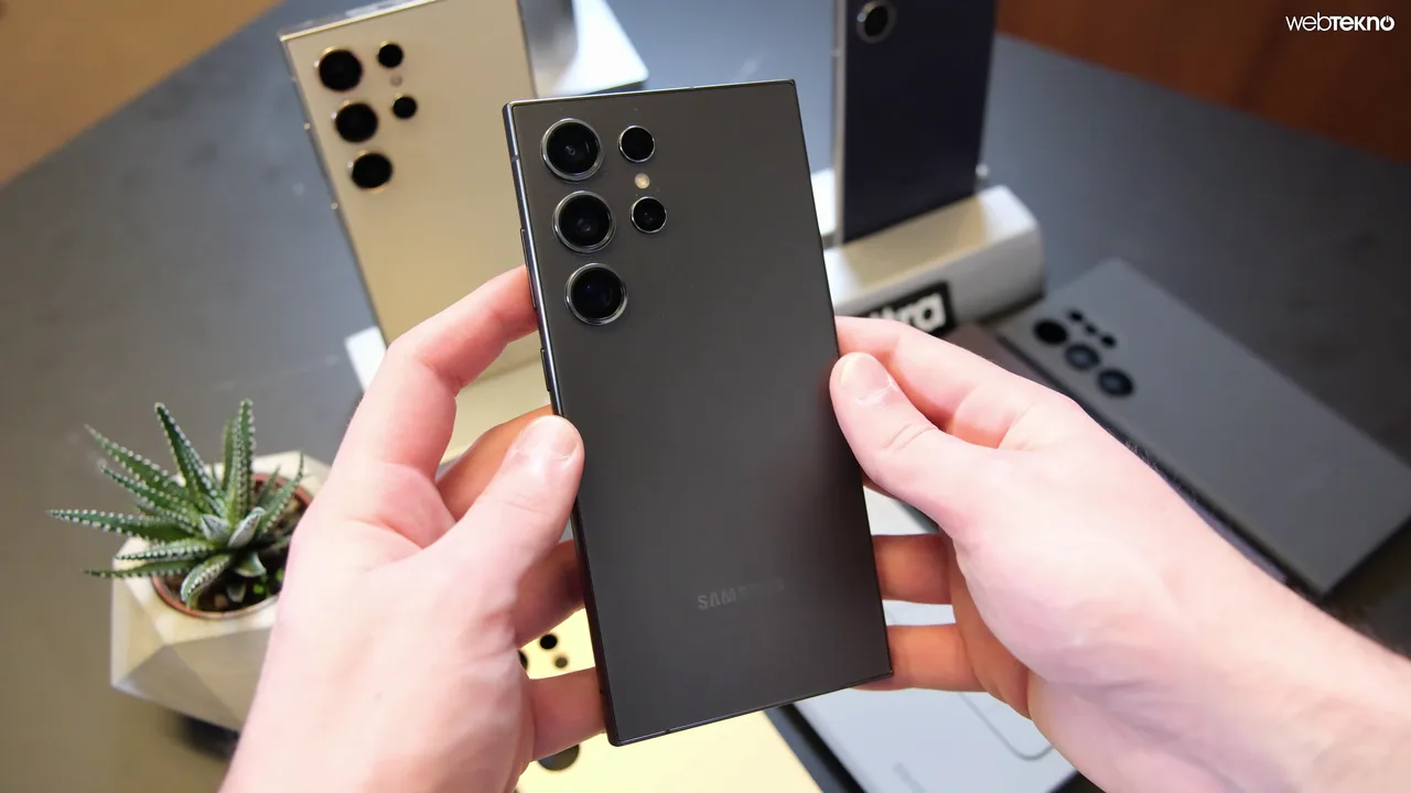 Hands holding the back of a Samsung Galaxy S24 Ultra at a device demonstration
